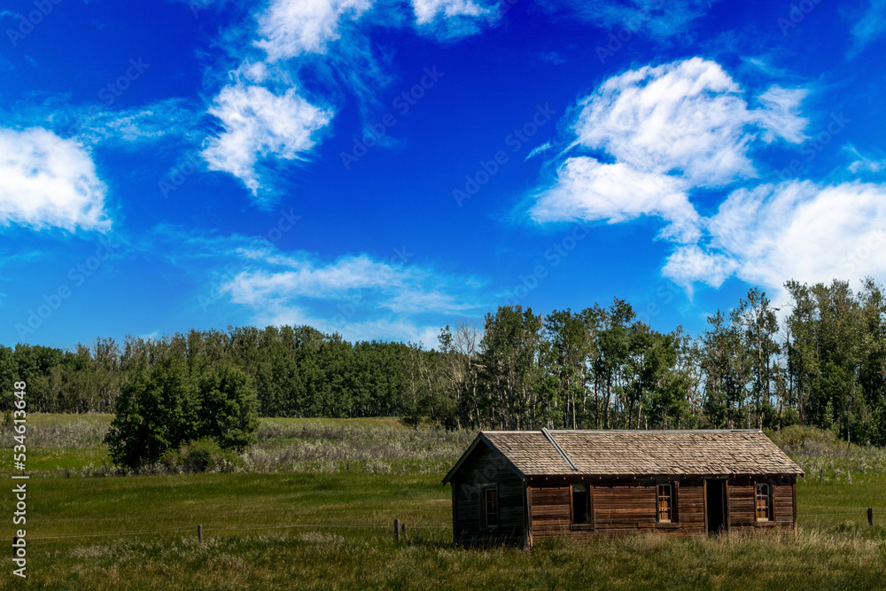 Fototapeta premium Rustic buildings in a farmers field Allingham Alberta Canada