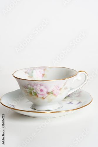 teacup on saucer plate isolated on white