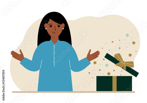 A woman next to an open gift. The concept of a holiday, surprise, promotion, discount.