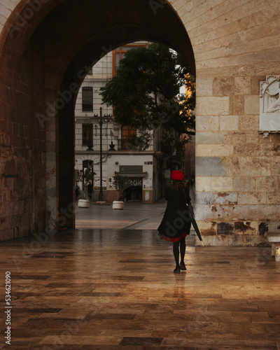 The woman in the red hat