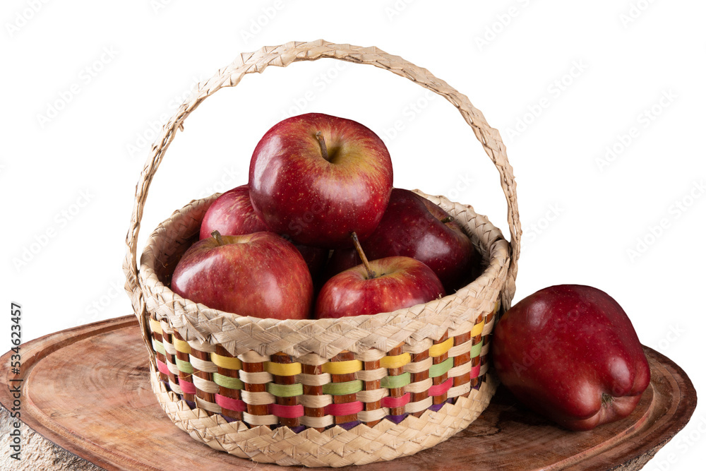Red apples in basket with wooden background Red apples in basket with wooden background