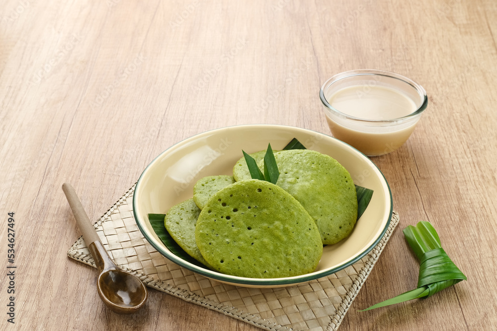 Serabi or Surabi, Indonesian pancake made of flour, rice flour and coconut milk. Served with palm sugar sauce. Sweet and savory.
Serabi or Surabi, Indonesian pancake made of flour, rice flour and coconut milk. Served with palm sugar sauce. Sweet and savory.