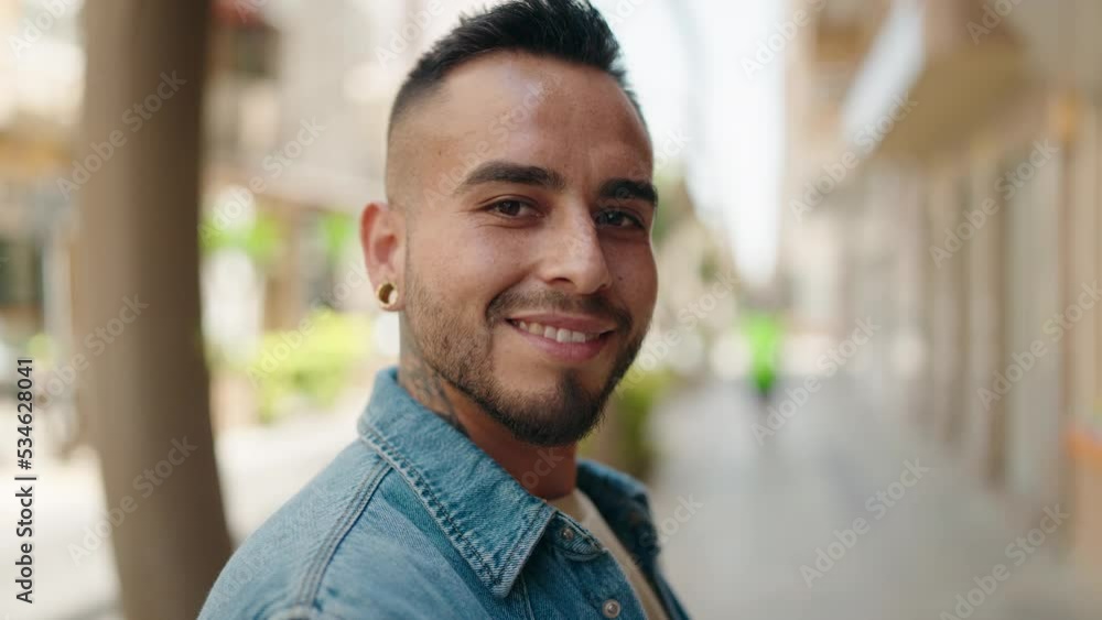 Young hispanic man smiling confident standing at street Young hispanic man smiling confident standing at street
