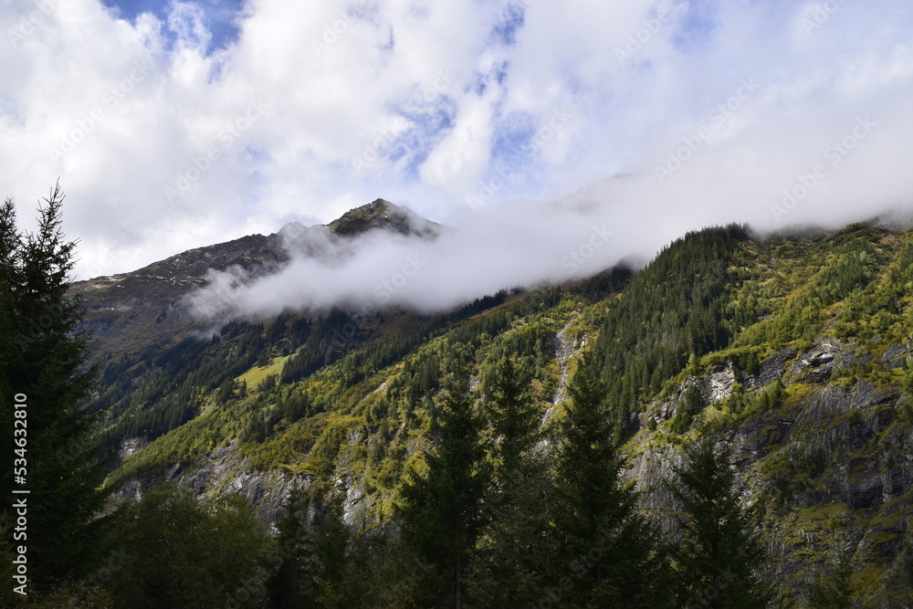 Outdoor mountain landscape with clouds