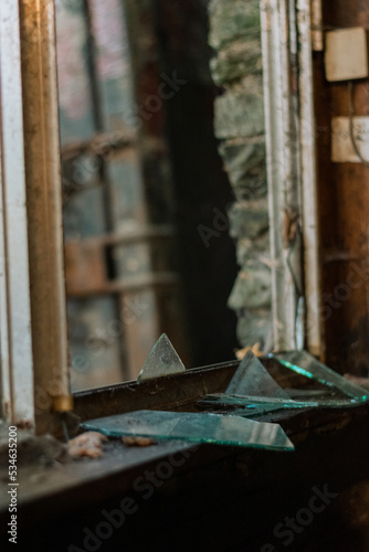 Reflection in Broken Glass in Abandoned Dirty House