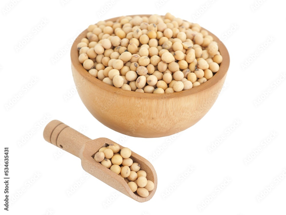 Soybeans in wooden bowl and scoop on white background. Closeup photo, blurred. Soybeans in wooden bowl and scoop on white background. Closeup photo, blurred.