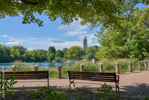 Naperville Riverwalk Quarry Lake | Bench in the Park Viewing  Millennium Carillon Tower in Naperville Illinois  