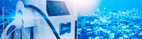 Futuristic EV charging station car,power cable and plug supply to car,green energy and eco power sustainable source technology,artificial intelligence or AI controls electricity supply with smart cars