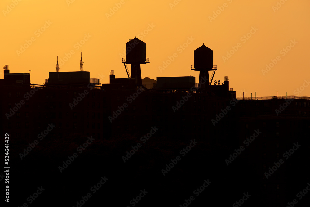 Water tower skyline silhouette at sunset