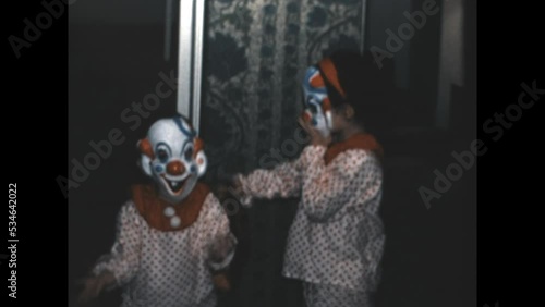 Creepy Clown Costumes 1969 - Siblings dress in matching creepy clown costumes for Halloween in 1969.  photo