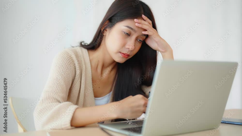 Office syndrome. Overworked tired young asian woman feeling headache, having eyesight problem after computer laptop work. Stressed young woman suffering from fatigue at home Office syndrome. Overworked tired young asian woman feeling headache, having eyesight problem after computer laptop work. Stressed young woman suffering from fatigue at home