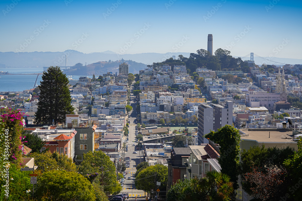 Skyline landscape view over the streets of San Francisco from Lombard Streets. Landmarks of this beautiful city from San Francisco photographed in a sunny day with blue sky.