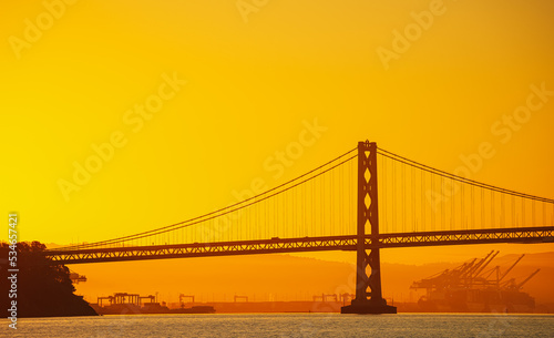 Transport industry architecture landmark Golden Gate bridge from San Francisco. Scenic image with this amazing construction from California during the sunrise.