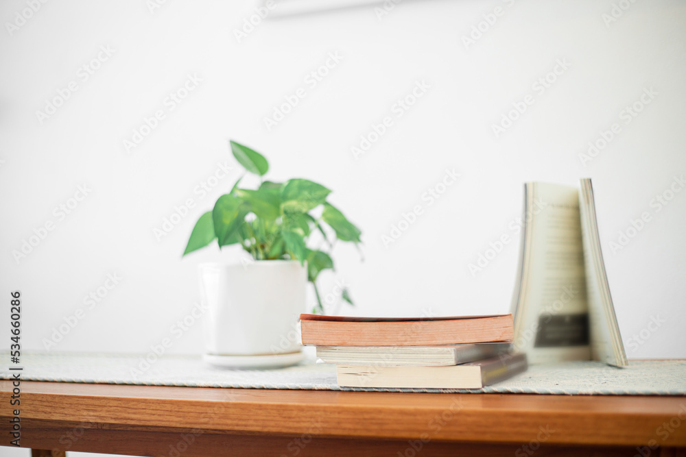 Books stack on wood desk and blurred background in the library room, education background, back to school concept. Image of education knowledge and study at school. Books stack on wood desk and blurred background in the library room, education background, back to school concept. Image of education knowledge and study at school.