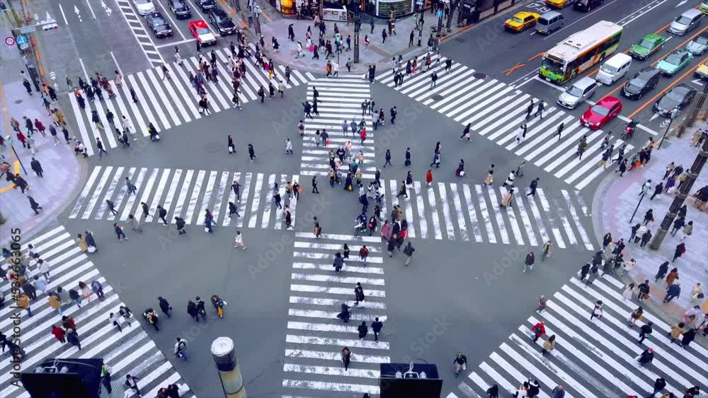 People passing the street crossing in Ginza district, Tokyo. Crosswalk. Intersection in Tokyo,Japan