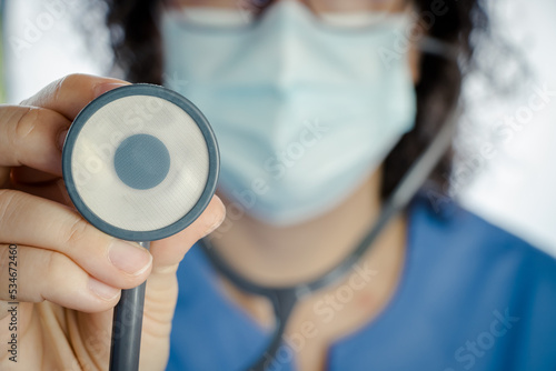 Принти на полотні nurse or sanitary auscultating with a stethoscope in front of the camera