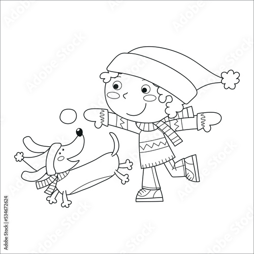 Little boy playing with his dachshund on winter