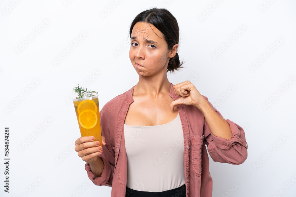 Young hispanic woman holding a cocktail isolated on white background proud and self-satisfied Young hispanic woman holding a cocktail isolated on white background proud and self-satisfied