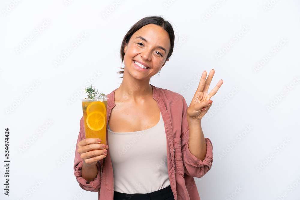 Young hispanic woman holding a cocktail isolated on white background happy and counting three with fingers Young hispanic woman holding a cocktail isolated on white background happy and counting three with fingers
