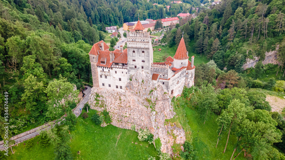 Aerial photography of the front of Bran castle in Brasov, Romania. Photography was shot from a drone at a higher altitude with camera pointing downwards for a top view.