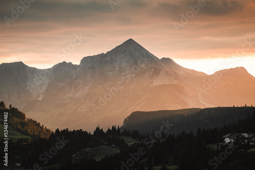 sunset in austria Alps in hohe tauern mountains, golden light in the mountains in Obertauer town