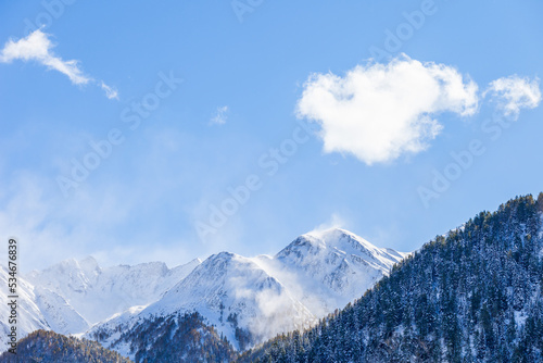 Beautiful mountain peaks with snow and a blue clear sky