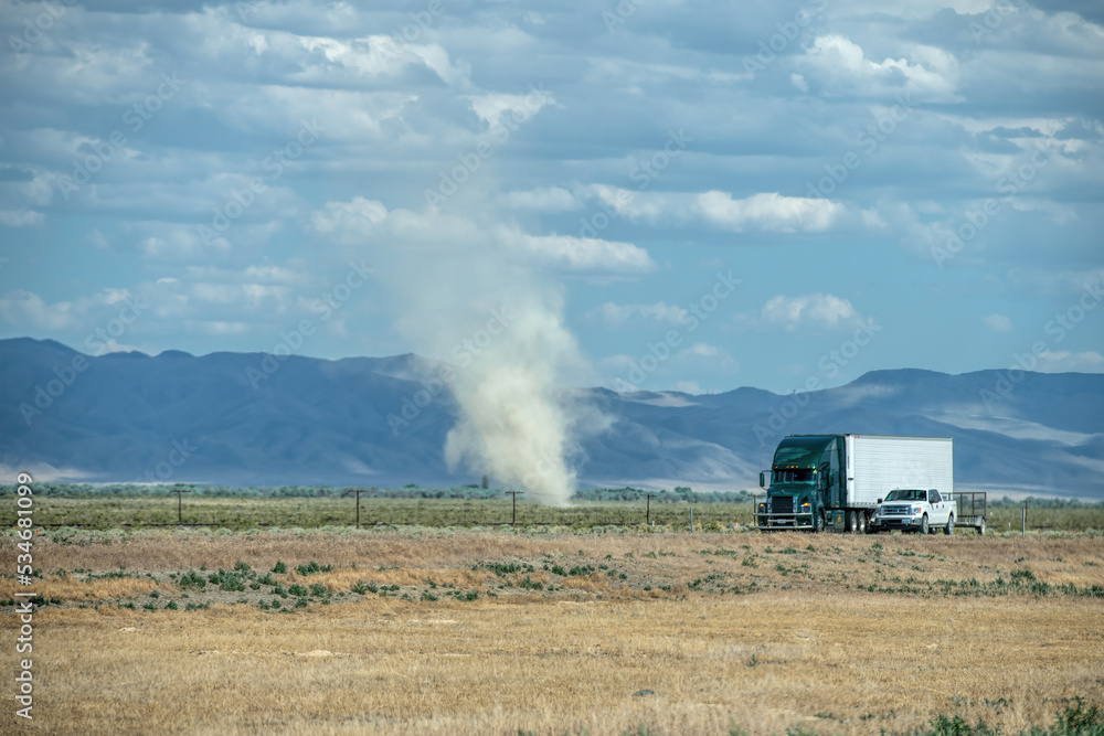 Fototapeta premium truck and dust tornado in usa