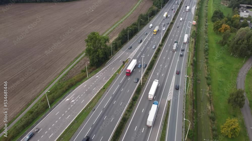 Drone aerial view of traffic at a highway ramp and cars merging into motorway lane in Antwerp, Belgium Drone aerial view of traffic at a highway ramp and cars merging into motorway lane in Antwerp, Belgium