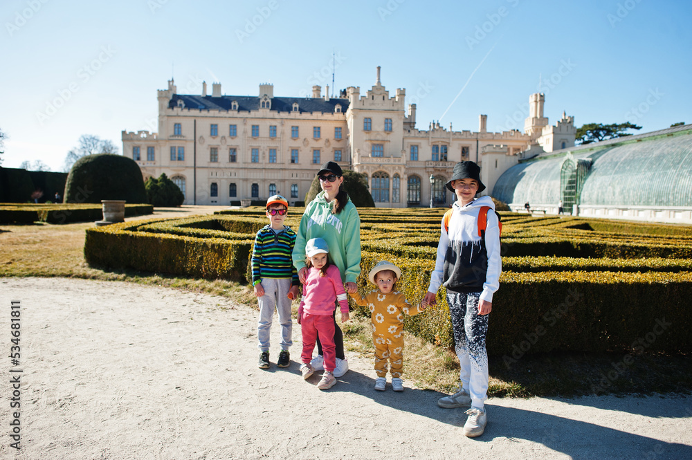 Obraz premium Mother with four kids at Lednice castle park, Czech Republic.