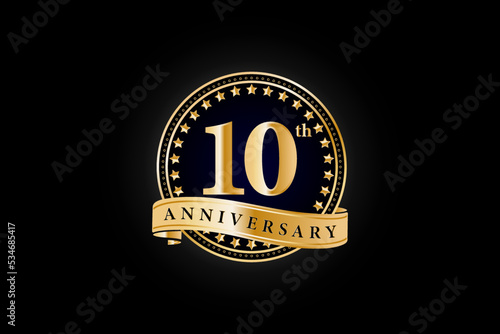 10th anniversary golden gold logo with gold ring and ribbon isolated on black background, vector design for celebration.