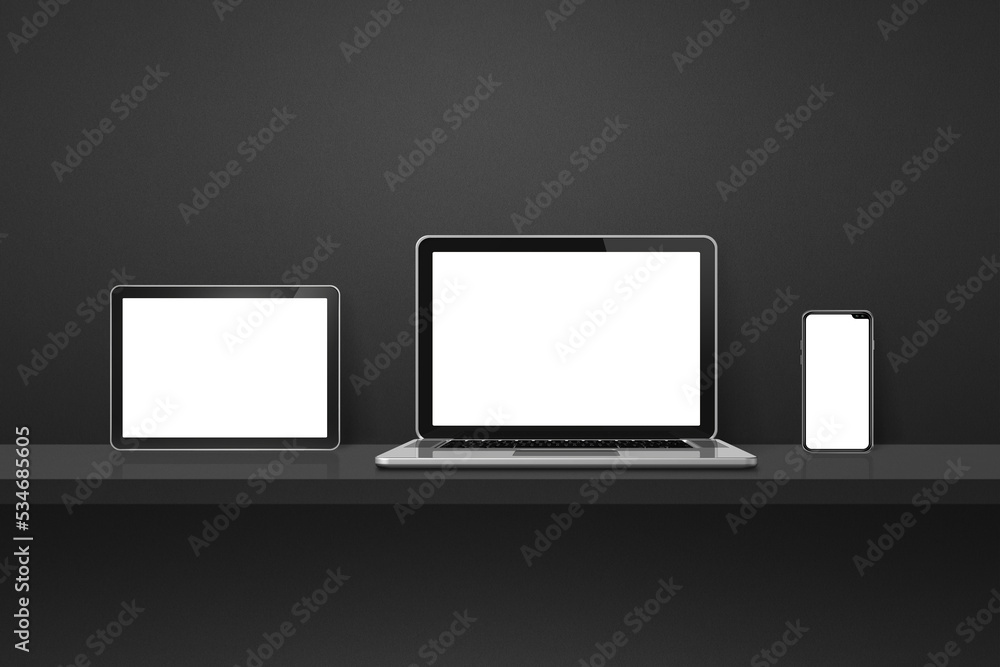 Laptop, mobile phone and digital tablet pc on black wall shelf. Horizontal background Laptop, mobile phone and digital tablet pc on black wall shelf. Horizontal background