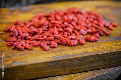 There are many naturally dried red wolfberries on the table