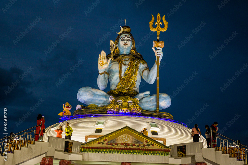 Pumdikot, Pokhara, Nepal Statue of Lord Shiva at night Stock Photo