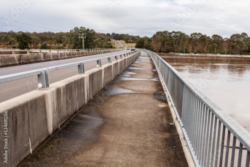 Wallpaper Mural Redbournberry bridge pedestrian footpath surrounded by floodwater during natural disaster of flood Torontodigital.ca