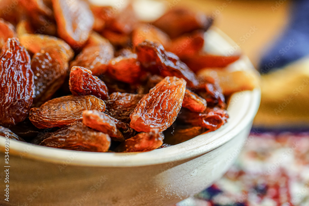 There are many naturally dried red raisins on the table There are many naturally dried red raisins on the table