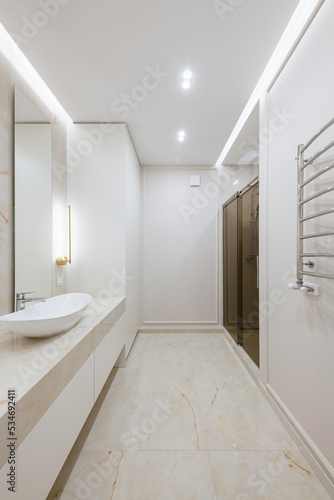 interior design of a bathroom with light tiles in the house