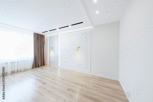 interior design of an empty room with a large window in a new bright house