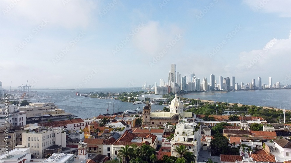 Colombia , Cartagena de Indias - Drone aerial view of the historic colonial style downtown with the church and the new modern district Bocagrande with  skyscrapers - Unesco Heritage world 
