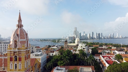 Obraz na płótnie Colombia , Cartagena de Indias - Drone aerial view of the historic colonial style downtown with the church and the new modern district Bocagrande with skyscrapers - Unesco Heritage world w salonie