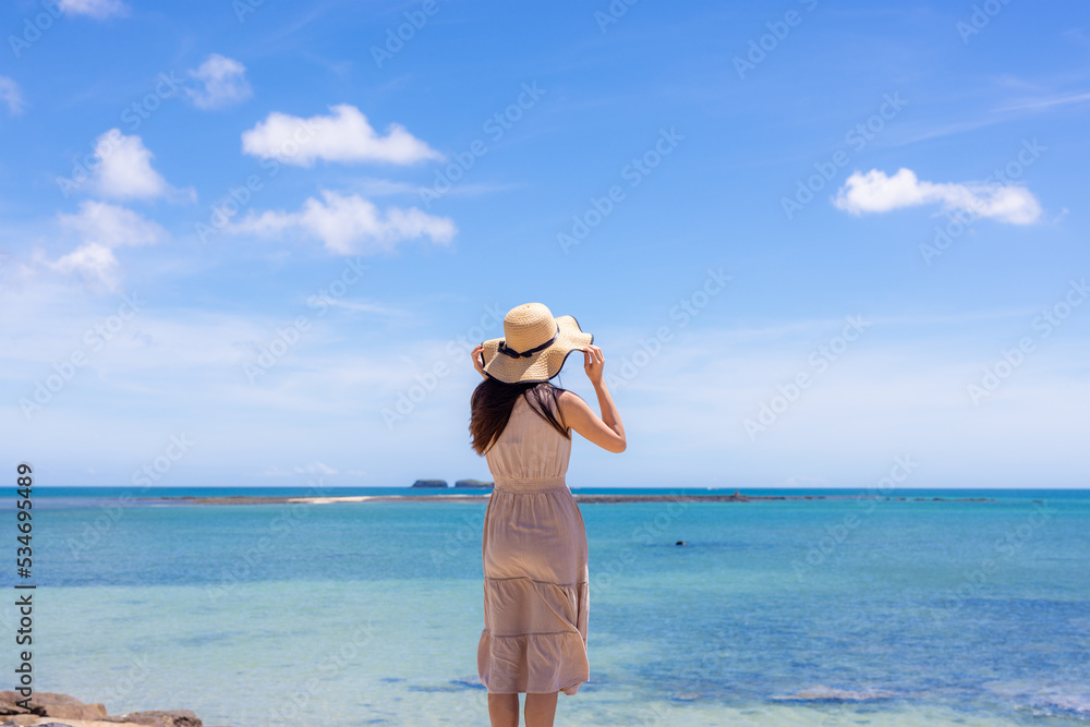 Travel woman go to the beach in Penghu of Taiwan