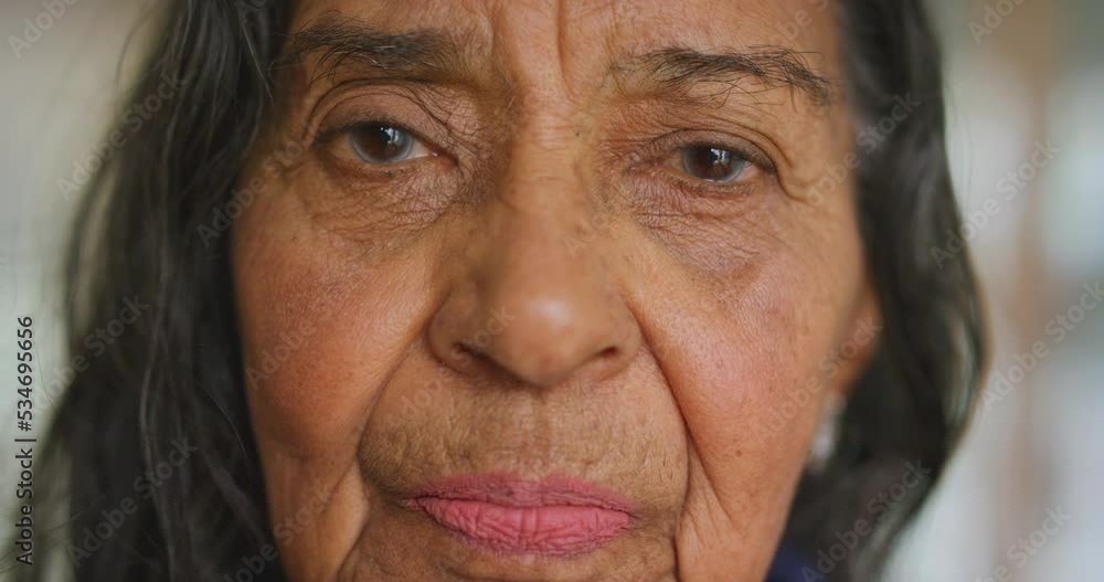 Senior mexican woman, face or thinking in a room or house for old people. Headshot portrait of retired elderly lady with on bokeh background in retirement home for mental health with relax break Senior mexican woman, face or thinking in a room or house for old people. Headshot portrait of retired elderly lady with on bokeh background in retirement home for mental health with relax break