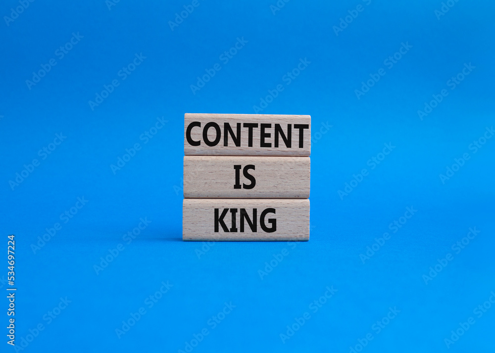 Content is king symbol. Concept words Content is king on wooden blocks. Beautiful blue background. Business and Content is king concept. Copy space. Content is king symbol. Concept words Content is king on wooden blocks. Beautiful blue background. Business and Content is king concept. Copy space.
