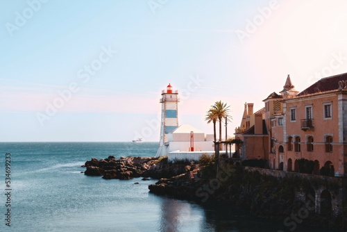 Old lighthouse in cascais at sunset, Lisbon © Pedro