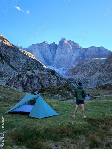 Hiker camping with tent in the mountains