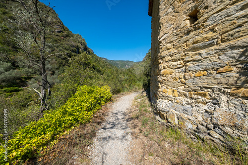 A mountain path with a little old church, above the village of Rocchetta Nervina; It's a small village of far west of Liguria Region (Northern Italy), near the French borders.