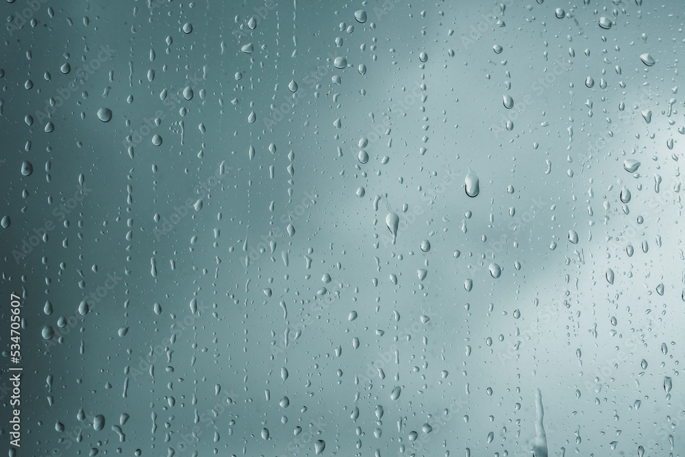 Close-up of rain drops on glass background. Premium colorful abstract background with dynamic shadow on background, consisting of water on glass, gradient color, artistic texture, epic, beautiful Close-up of rain drops on glass background. Premium colorful abstract background with dynamic shadow on background, consisting of water on glass, gradient color, artistic texture, epic, beautiful