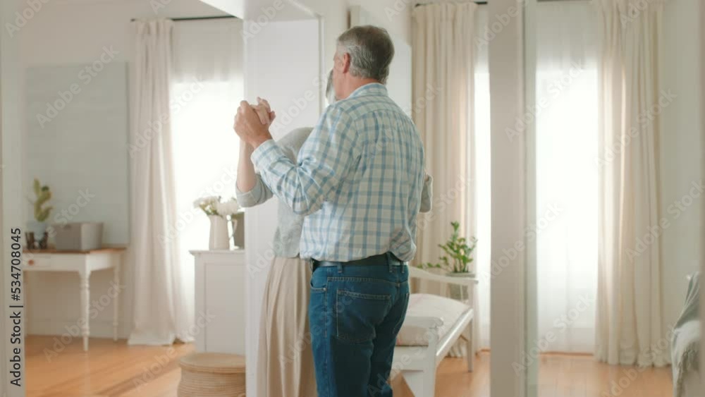 Happy senior couple, slow dancing and love together in romance happiness for relationship at home. Elderly man and woman share a sweet romantic and gentle dance at the house on a retirement break Happy senior couple, slow dancing and love together in romance happiness for relationship at home. Elderly man and woman share a sweet romantic and gentle dance at the house on a retirement break