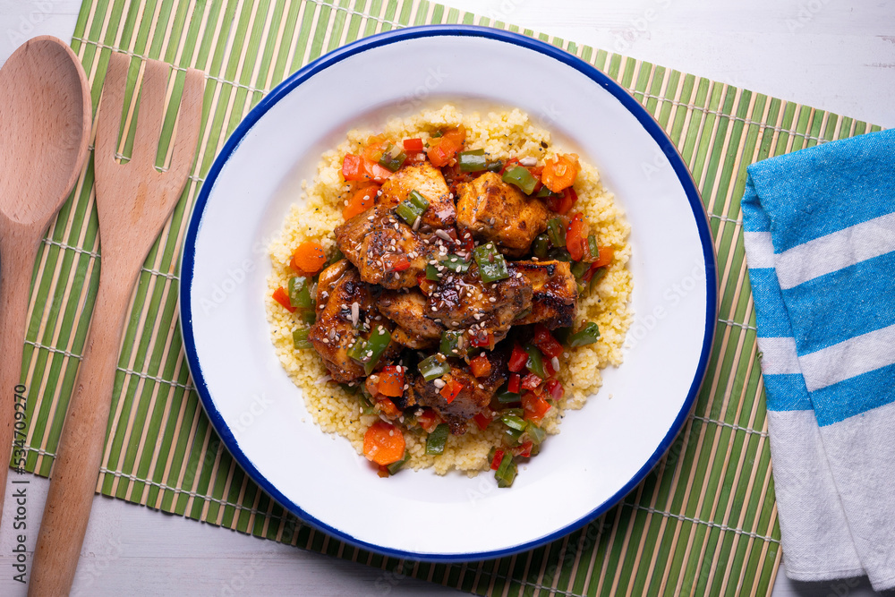 Marinated chicken with vegetables and couscous. Traditional African recipe. Marinated chicken with vegetables and couscous. Traditional African recipe.