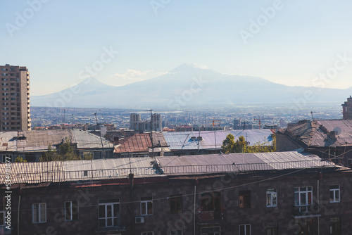 Yerevan, Armenia, beautiful super-wide angle panoramic view of Yerevan with Mount Ararat, cascade complex, mountains and scenery beyond the city, summer sunny day photo