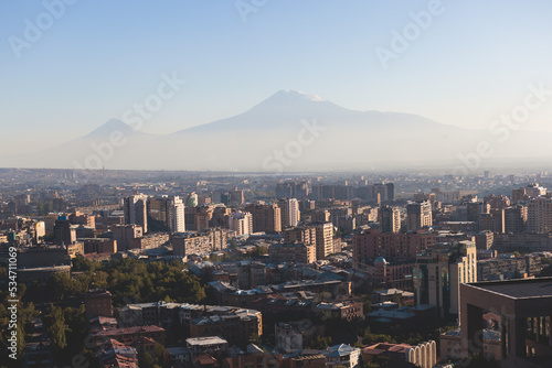 Yerevan, Armenia, beautiful super-wide angle panoramic view of Yerevan with Mount Ararat, cascade complex, mountains and scenery beyond the city, summer sunny day photo